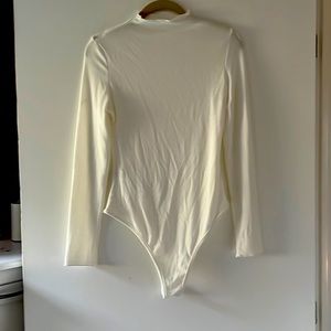 Mock neck white body suit, never worn